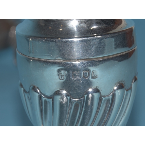 12 - An Edwardian silver mustard of circular form, with gadrooned rim and hinged lid, on three hoof feet,... 