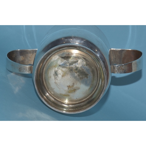 18 - A silver two-handled loving cup with inscription, 10.3cm high, London 1963, maker Robert Edgar Stone... 