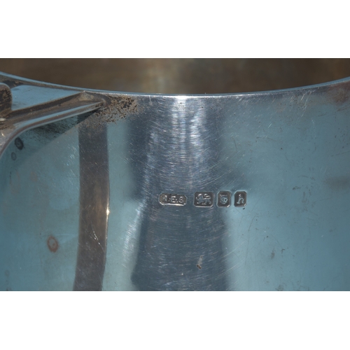 18 - A silver two-handled loving cup with inscription, 10.3cm high, London 1963, maker Robert Edgar Stone... 