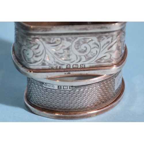 24 - A cased set of six silver 'bean' coffee spoons, Sheffield 1936, two silver napkin rings, a white met... 