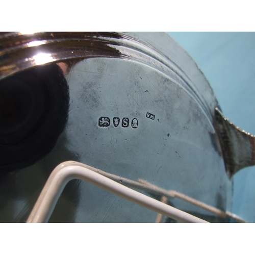 34 - A George III circular silver salver with gadrooned border, on tapering scroll feet, with engraved ce... 