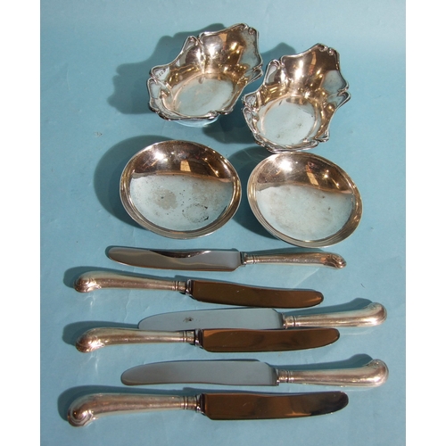 36 - A pair of silver boat shape bonbon dishes, 15 x 8cm, 4cm high, Birmingham 1904, a pair of circular s... 