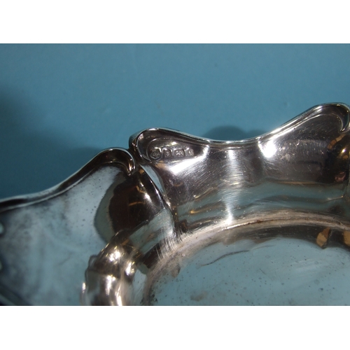 36 - A pair of silver boat shape bonbon dishes, 15 x 8cm, 4cm high, Birmingham 1904, a pair of circular s... 