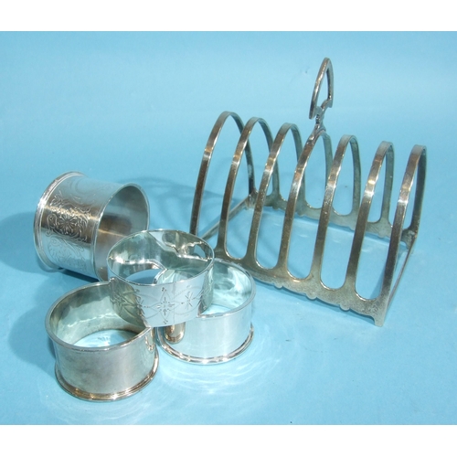 41 - A George V silver six-section toast rack, 10.5cm long, 11cm high, Birmingham 1915, together with fou... 