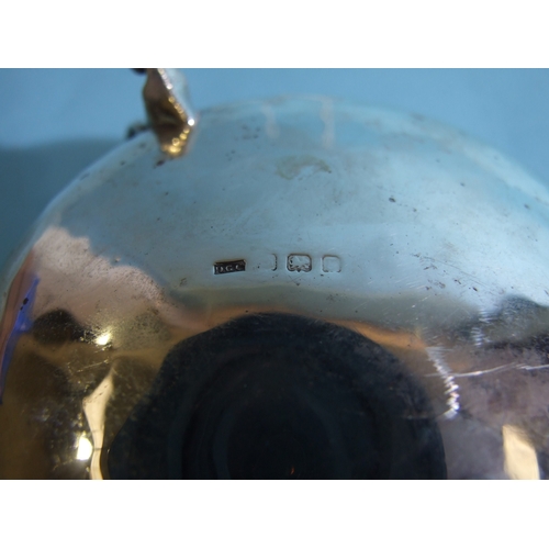 45 - An Edwardian silver circular sugar bowl in the Art Nouveau style, having three tendril-shaped handle... 