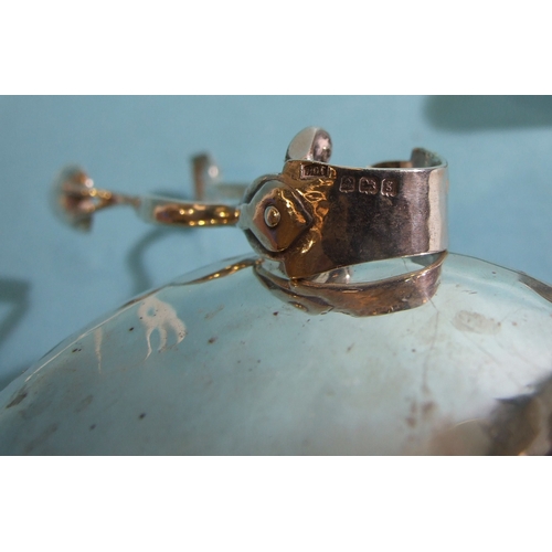 45 - An Edwardian silver circular sugar bowl in the Art Nouveau style, having three tendril-shaped handle... 