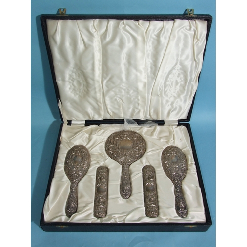 53 - A 20th century six-piece sterling silver dressing table set, comprising: hand mirror, two hair brush... 