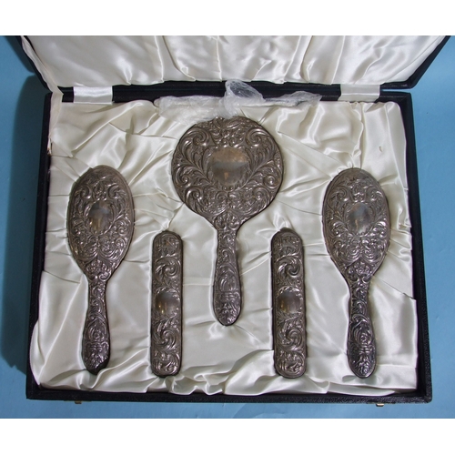 53 - A 20th century six-piece sterling silver dressing table set, comprising: hand mirror, two hair brush... 