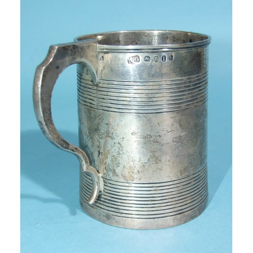 54 - A George III silver cylinder-shaped reeded tankard engraved 