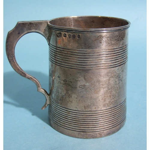 54 - A George III silver cylinder-shaped reeded tankard engraved 