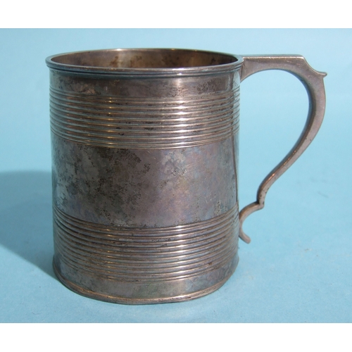 55 - A George III silver cylinder-shaped reeded tankard with engraved crest and initials, 7.5cm high, Lon... 
