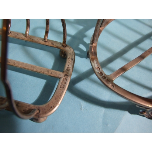 59 - A Victorian silver oval toast rack on pierced scroll feet, 13.5cm high, Sheffield 1858, maker MH &am... 