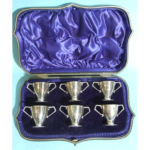 60 - A set of six miniature silver two-handled cups, each 4cm high, London 1910, total weight 182.5g, ___... 