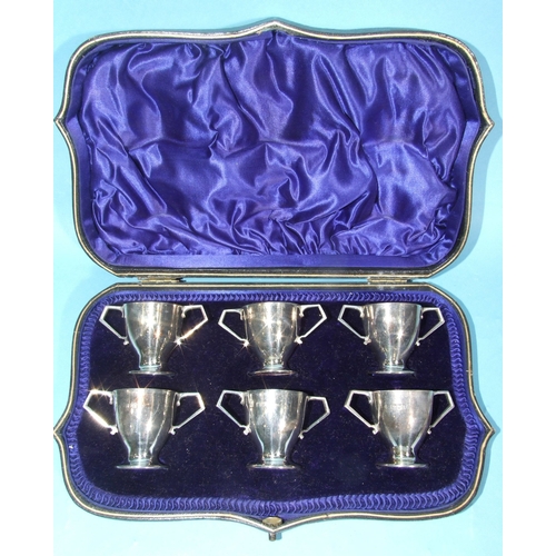 60 - A set of six miniature silver two-handled cups, each 4cm high, London 1910, total weight 182.5g, ___... 