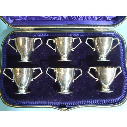 60 - A set of six miniature silver two-handled cups, each 4cm high, London 1910, total weight 182.5g, ___... 
