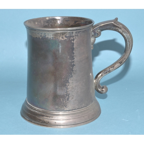 8 - A George II silver tankard of plain form with 'S' shape handle, engraved lion holding an anchor cres... 