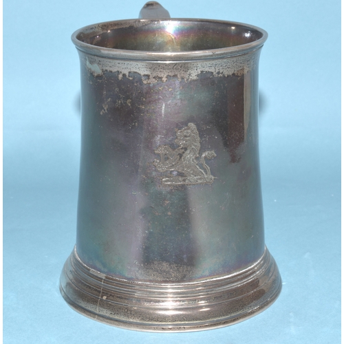 8 - A George II silver tankard of plain form with 'S' shape handle, engraved lion holding an anchor cres... 