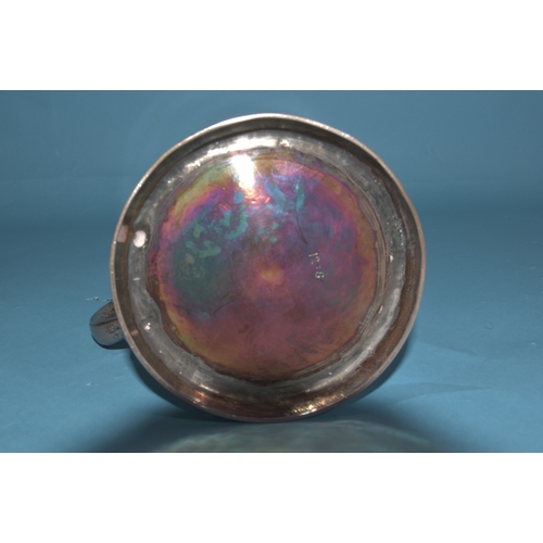 8 - A George II silver tankard of plain form with 'S' shape handle, engraved lion holding an anchor cres... 