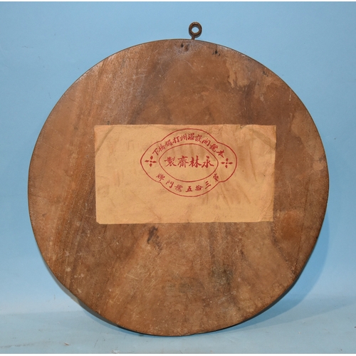 36 - A 19th century Chinese circular wooden plaque inlaid with coloured stones depicting scholars on a te... 