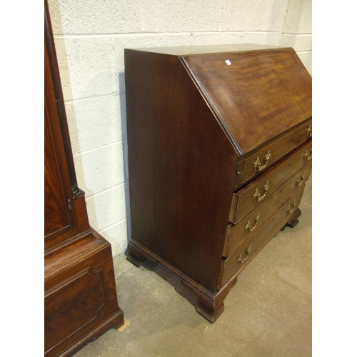 5 - A George III mahogany bureau, the fall front enclosing the serpentine-shaped inlaid satinwood fitmen... 