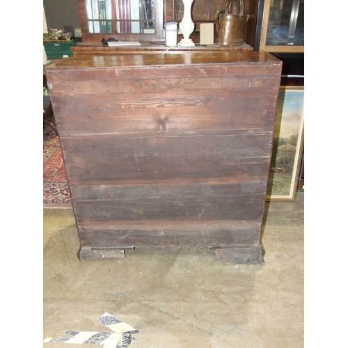 5 - A George III mahogany bureau, the fall front enclosing the serpentine-shaped inlaid satinwood fitmen... 