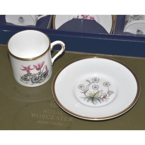 11 - Two Royal Worcester boxed sets of six each coffee cans and saucers decorated with Alpine flowers, (w... 