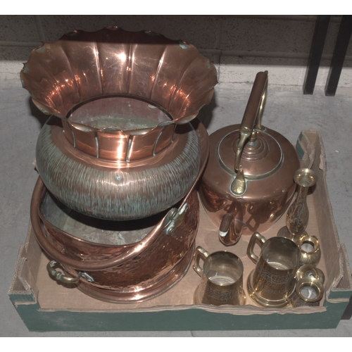 19 - A copper planter with wavy rim, 22.5cm high, 30cm diameter, a copper kettle, a beaten-copper coal he... 