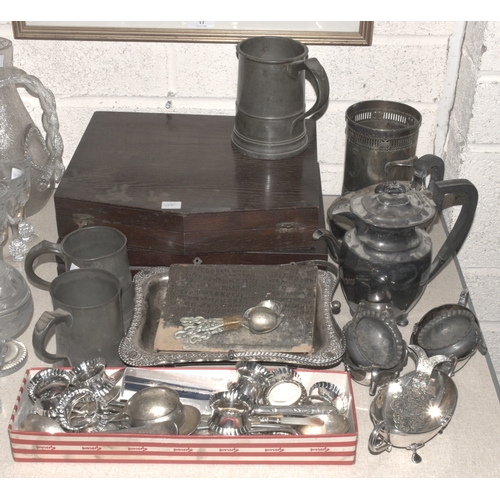 26 - A collection of plated ware, including bottle stand, teapot, cutlery, three pewter tankards, etc.... 