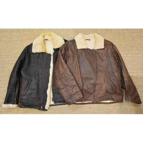 55 - A brown leather and sheepskin flying jacket, no manufacturer's label, size 12, (worn) and another wi... 