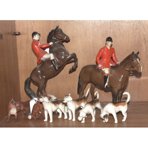 99 - A Beswick huntsman on brown gloss horse, standing, 21cm high, a Beswick huntsman on rearing horse, s... 