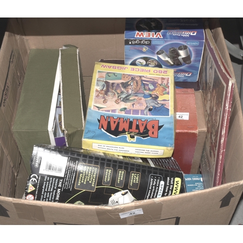 42 - A large quantity of Waddington and other games, a Teksta robotic puppy and other items.... 