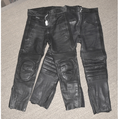 43 - Two pairs of gent's black leather motorcycle trousers, size 30, (2).