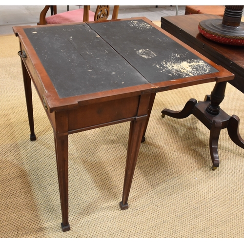 4 - A late-Georgian mahogany and ebony-lined fold-over card table, on central column and four swept legs... 