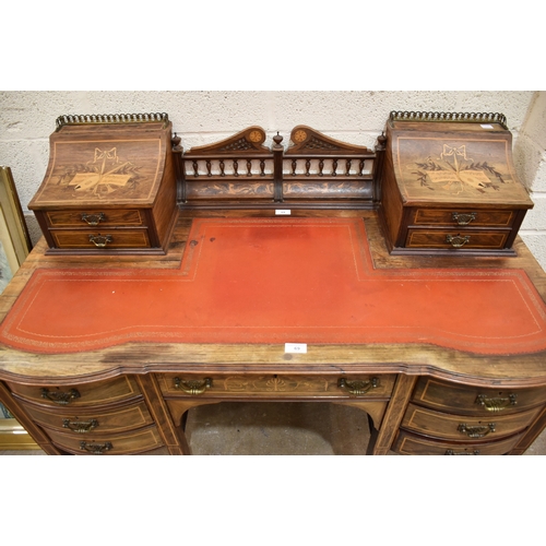 7 - A good-quality Edwardian and marquetry rosewood writing desk, the shaped top with drawers and compar... 