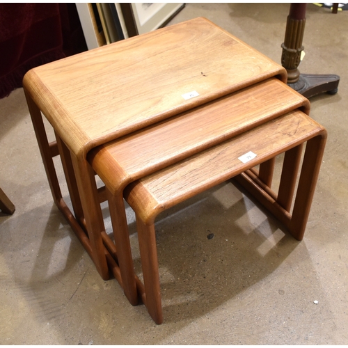 10 - A nest of three light hardwood occasional tables of Danish design, labelled O'Donnell Design Ltd, Co... 