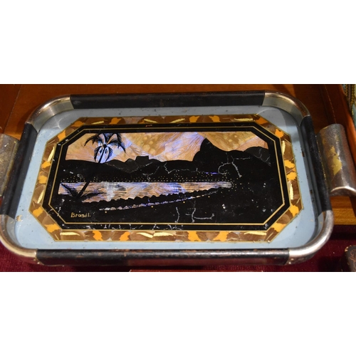 59 - A small circular tortoiseshell-lined box and cover, the cover with an oval painted scene of a couple... 