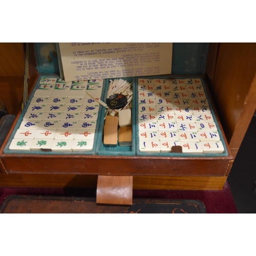 59 - A small circular tortoiseshell-lined box and cover, the cover with an oval painted scene of a couple... 