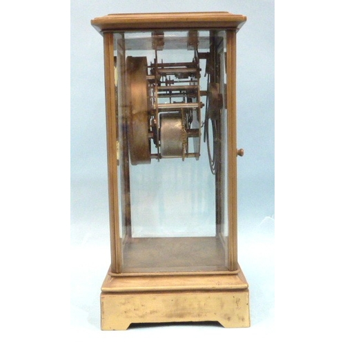 23 - A late-19th century four-glass brass mantel clock, the two-piece dial with visible escapement and go... 