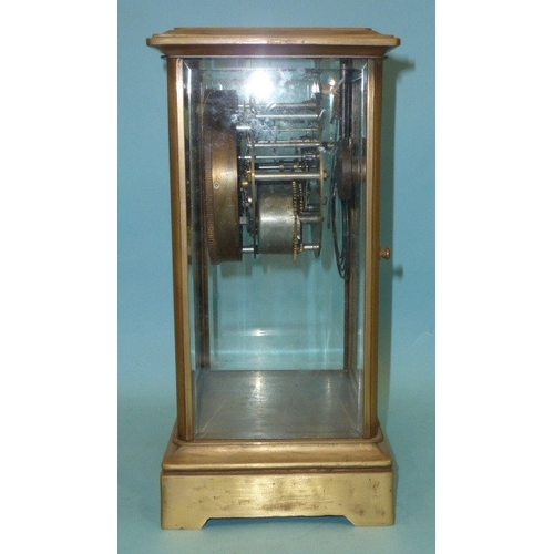 23 - A late-19th century four-glass brass mantel clock, the two-piece dial with visible escapement and go... 