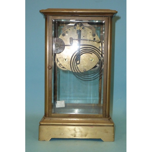 23 - A late-19th century four-glass brass mantel clock, the two-piece dial with visible escapement and go... 