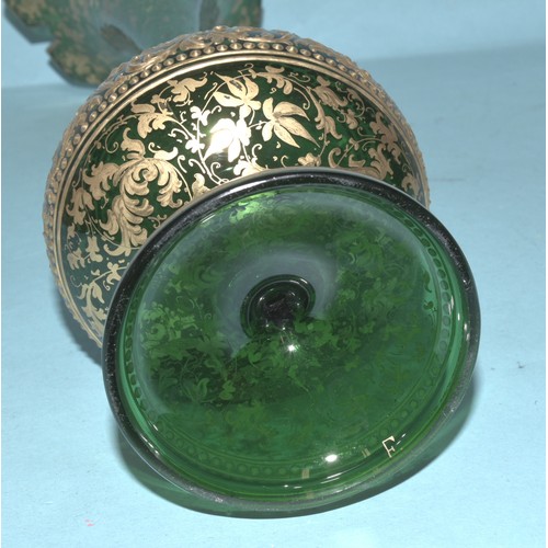 33 - A Continental red and gilt glass lustre vase decorated with vignettes of young women and flowers wit... 