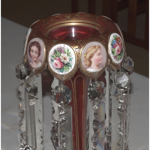 33 - A Continental red and gilt glass lustre vase decorated with vignettes of young women and flowers wit... 