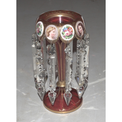 33 - A Continental red and gilt glass lustre vase decorated with vignettes of young women and flowers wit... 