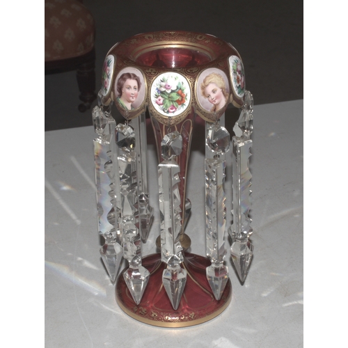 33 - A Continental red and gilt glass lustre vase decorated with vignettes of young women and flowers wit... 