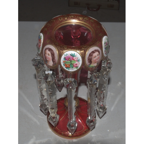 33 - A Continental red and gilt glass lustre vase decorated with vignettes of young women and flowers wit... 