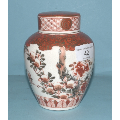 42 - A pair of Japanese Arita ginger jars with interior covers and lids decorated with blossom and birds,... 