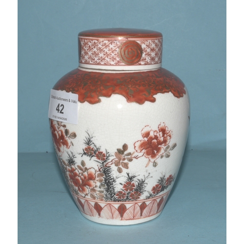 42 - A pair of Japanese Arita ginger jars with interior covers and lids decorated with blossom and birds,... 