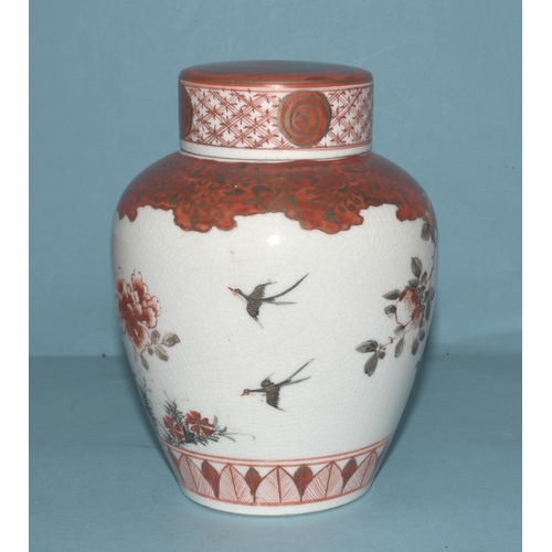 42 - A pair of Japanese Arita ginger jars with interior covers and lids decorated with blossom and birds,... 