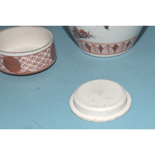 42 - A pair of Japanese Arita ginger jars with interior covers and lids decorated with blossom and birds,... 