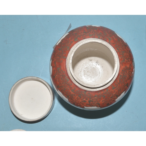42 - A pair of Japanese Arita ginger jars with interior covers and lids decorated with blossom and birds,... 